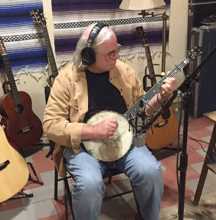 Dave Miller playing banjo in the recording studio