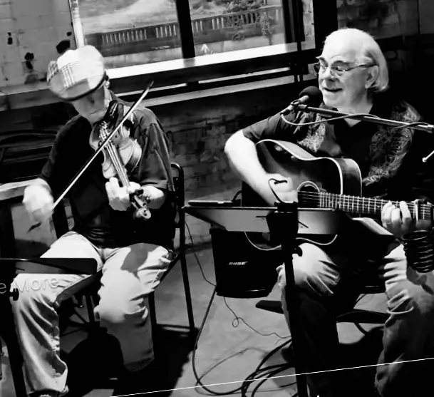 Dave Miller with fiddle player, black and white